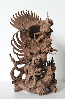 Hindu Garuda carving on a wooden shelf