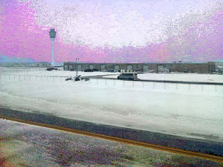 Snow-covered cornfields and prairie landscape at dusk