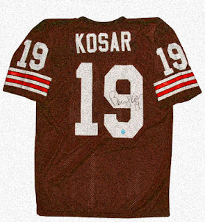 Young man with glasses helping a customer at a tech store