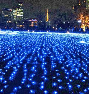 Sunset over airport tarmacs with blue LED lights glowing